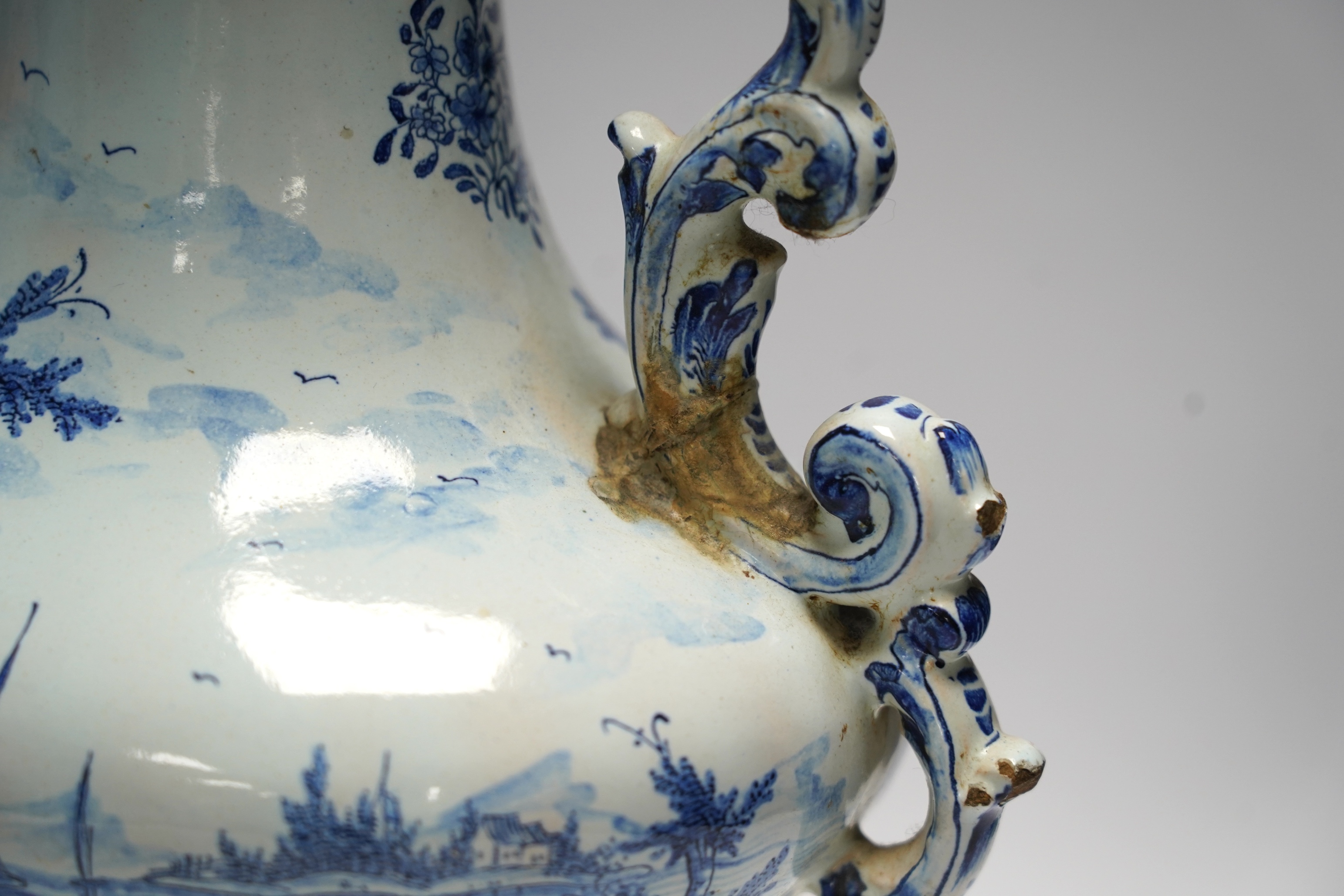 A pair of 19th century Delft blue and white vases, 35cm high. Condition - poor